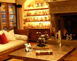 Hammered copper coffee table is an iconic feature of the living room